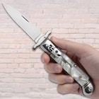 The Marble Automatic Stiletto Knife held displayed in hand