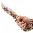 This image depicts a hand holding the Bear Bowie Knife.