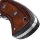 The bloodwood handle scales are attached to the full tang with nickel silver pins and the handle features a stainless steel sub-hilt