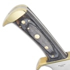 Side view of the gray hardwood handle with brass-plated guard and angled brass-plated pommel.