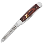 The Ranch Hand Trapper Pocket Knife has ranch themed artwork