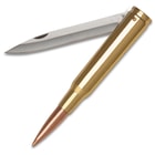 The blade is shown angled away from the polished brass plated metal case and copper-plated bullet on the tip.
