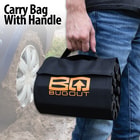 The BugOut Roll-Up Traction Tracks are shown rolled into its carry bag held with the bag logo facing outward.