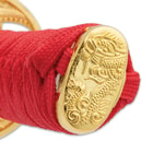 The hardwood handles are wrapped in faux rayskin and red cord-wrap, topped with a polished gold-colored metal pommel