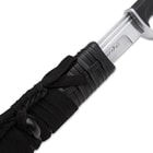 Sword in black braided sheath with an inch of carbon steel blade showing
