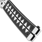 A detailed view of the butterfly knife's handle