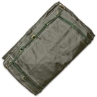 The like new duffle bag is made of water-resistant, olive drab vinyl material and has a single sturdy shoulder strap