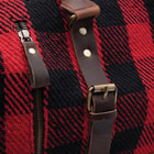The Trailblazer Buffalo Plaid Weekend Bag has leather strap and buckle accents