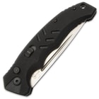 The pocket knife is opened with a push button and swings open by means of the tensioned spring behind it