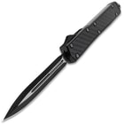 The knife is shown with two toned black and silver blade fully deployed from the grippy black handle with carbon fiber insets.