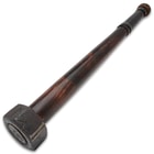 This image shows the mean looking metal club head on this hardwood war club.