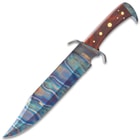 Side view of the bowie knife with Fire Kissed 1095 carbon steel blade and brown hardwood handle with brass pin accents.