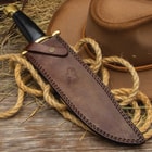 The 16” bowie knife can be stored and carried in its genuine, premium leather belt sheath, which has a snap strap closure