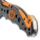 Close up image of the handle and glass breaker of the Ridge Runner Assisted EMT Pocket Knife.