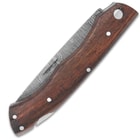 The handle scales are wooden with stainless steel pins