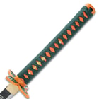 The green cord-wrapped handle