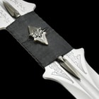 Leather wrapped blade grip is shown with cast metal insignia.