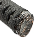 The pommel is intricately designed with dragon detailing. 