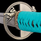 Zoomed view of the cast metal tsuba and teal cord wrapping the handle. 