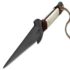 Angled view of the Kombat Kunai Thrower with pewter colored blade, faux ivory handle, and rope lanyard attached to the open ring pommel.