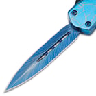 A close-up captures the brilliance of the razor-sharp stainless steel metallic blue double-edged blade on the Lightning Blue Knife.