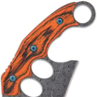 The handle scales are ergonomically grooved bloodwood, secured with heavy-duty screws, and it features thumb jimping