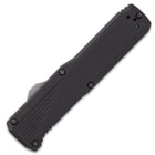 Closed gunmetal switxhblade with light grey trigger button on top left side and decorative grooves.
