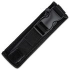 Large OTF automatic knife enclosed in a black nylon sheath with a buckle closure. 
