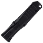 The 3 1/2” handle is black CNC-milled, anodized aluminum, and the trigger switch is conveniently located on top
