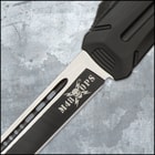 Closed OTF knife with a matte black handle and a pocket clip with a white "M48" logo inscription and a glass breaking pommel.
