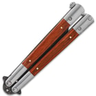 Closed butterfly knife with wooden handles