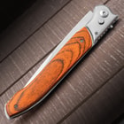 The automatic pocket knife shown in its closed position