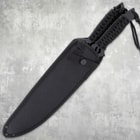 Black nylon sheath holding two machetes
