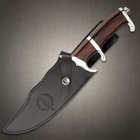 The fixed blade is 12 1/2” in overall length and fits like a glove in its included leather belt sheath