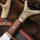 Zoomed view of the stag antler handle with forked pommel on the Timber Wolf Stag Antler Fixed Blade.