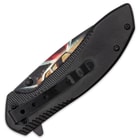 It has black, aluminum handle scales with orange 3D printed wood facing that has General Lee themed artwork
