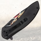 Closed folding knife with black handle and clip