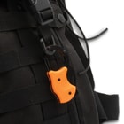 Orange RaptorClip attached to backpack
