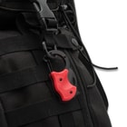 Red RaptorClip attached to backpack