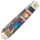 The pocket knife has colorful acrylic and black bone handle scales.