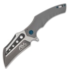 Hawk-bill style blade pocket knife with blue accents and "Mavrokniv" etching.
