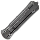 Closed dark grey pocket knife with matte finish and tactical styling featuring a glass breaking pommel on the top end. 
