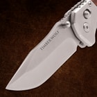 Close-up of knife blade with 'Timber Wolf' text