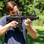 Crosman DPMS SBR Full Automatic Air Rifle - Nylon Fiber Stock, Steel Barrel, Quad Rail, Blowback, Folding BUIS Sights, 430 FPS