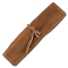The dining set inside of its leather pouch