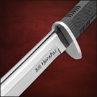 Close view of honshu katana sword encased in black leather sageo
