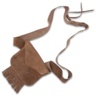 The bag has an adjustable shoulder strap and a fringe accent