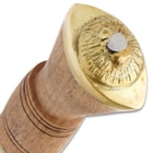 The polished, hardwood handle is reinforced by a brass bolster and a brass pommel with a raised lion’s head decoration