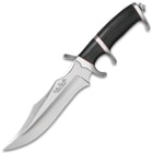 Mirror polished fighter knife with a black micarta handle with red accents and various curved edges. 

