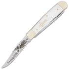 The trapper has a clip point blade with laser-etched artwork
